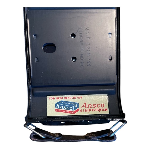 Black Film Photography Camera with Textured Body and Circular Lens - Picture 9 of 11